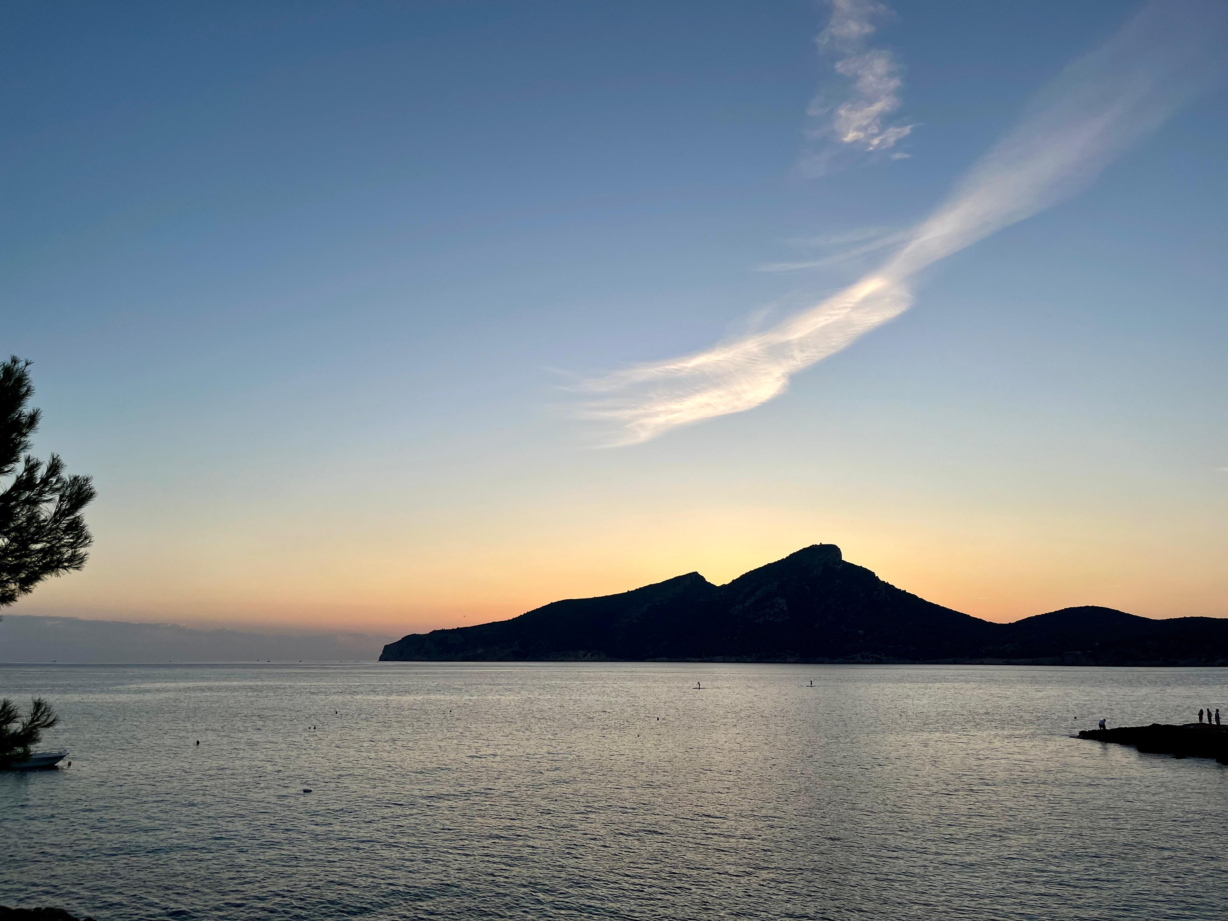 Mallorca coastline at sunrise with limestone cliffs and turquoise Mediterranean sea